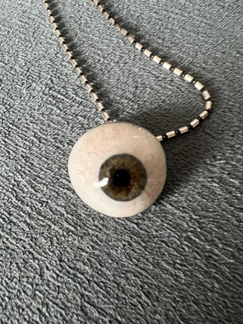Prosthetic eyeball necklace