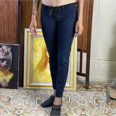 Super cute jeans by JBranduarte, a collaboration between J Brand and Henry Duarte. These blue jeans feature lace-up front closure as well as lace-up at the ankles. Low-rise skinny jeans. Missing some metal rivets at lower back ankle (see photos.) Size 27.   Measurements:  30” - Waist 28” - Inseam 7” - Front Rise 13” - Back Rise