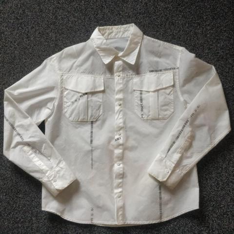 Kanghyuk Ready-Made Airbag Shirt, M-L

Shirt by experimental Korean brand Kanghyuk from their collection 8 (A/W 2020). Entirely made from recycled airbags featuring the original prints. Insane construction with great detail, oversized fit and wide sleeves (also works great as outer layer). Quite warm, because the airbag nylon is essentially an insulation layer (and somewhat water resistant). This rare archival collector's item honestly doesn't even have to be worn. It looks great hung somewhere too (see video). Fabric is see-through (video), so you can play with wearing different colours. Great for cyberpunk or experimental looks.

Colour: Off White
Condition: 9/10 only worn like twice. Some discoloration from the nature of the recycled airbags. Comes with official tags & 3 Kanghyuk branded spare buttons

Open to serious offers. Retail price was £700.
Size: M, fits Large (oversized)

Shoulders 50cm
Chest 56cm
Length 70cm
Sleeves 63cm

#archival #airbag #kanghyuk #avantgarde #designer