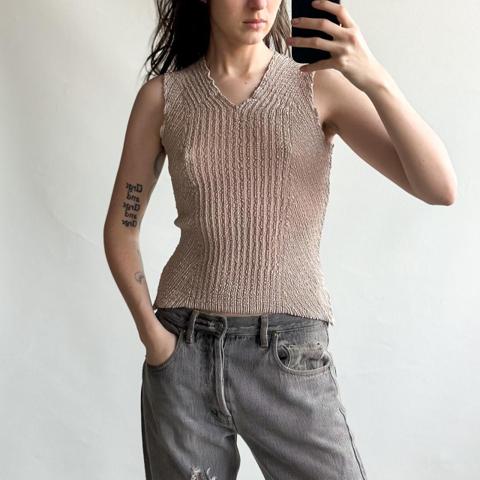 Yoshiki Hishinuma vintage 00s crinkle tan/beige sleeveless top. 

➖FREE SHIPPING ON BUNDLES  

Gorgeous piece– can be worn with either side in front. Very good vintage condition. Tag size 2 (on a 1/2/3 scale); probably best fits up to a medium (please check measurements; shown on a small). 

Approximate flat measurements:
Pit to pit: 18, has tons of stretch
Shoulder to hem: ~18 (uneven hem)

*measurements taken on the outside of the piece, and may have some minor discrepancy of human error since most garments are not rigid objects*

Model’s measurements: 
Height: 5’6” 
Waist: 26” 
Bust: 34A 

➖ FOLLOW on Instagram for a first look at new pieces

#designer #japanese #streetstyle #minimalist #avantgarde
