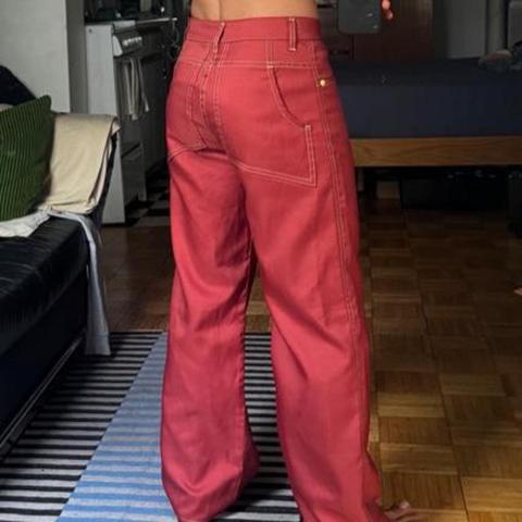 Eckhaus Latta 
Burgundy Red Wide Leg Pants 
Size 28 

Very 70s. Very cool. 

28” waist
28” inseam
38” total length 

Small signs of wear and tear here and there but hardly noticeable when worn. See photos.