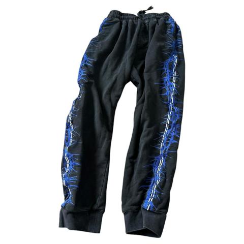 Haider Ackermann embroidered trackpants barbed wire thorn vines down either side 

Worn and have wash fade 

RRP: $1,020 USD




G6