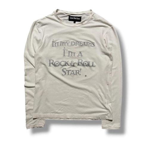 Lieve Van Gorp AW00 Rock & Roll Star Longsleeve T-Shirt

Features a print with the text “in my dreams I’m a rock & roll star!” along with glitter on the bold font. Fits like a medium. Small holes near tag area. Back says “But I cant sing!” Tagged size 1