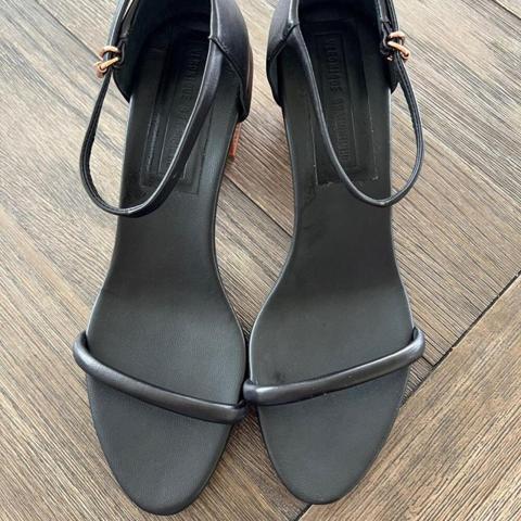 Step out in style with these Veronique Branquinho black shoes! 

Crafted with quality and designed for comfort, these shoes are a must-have for any fashion-conscious individual. 

The classic black color ensures they will pair perfectly with any outfit, making them a versatile addition to your wardrobe.

Size: 10

Condition: Excellent

Don't miss the opportunity to add these gorgeous shoes to your collection. Grab them now before they're gone!