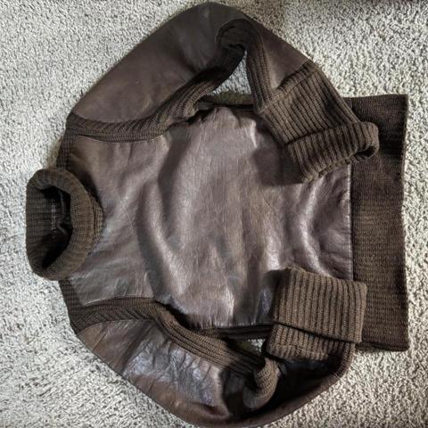 Rare A.F. Vandevorst Archive Leather Panel Red Cross Turtleneck Sweater

Exceptional archival A.F. Vandevorst piece combining a dark brown chunky knit with large leather body panels and the house’s signature red cross embroidery.

A beautiful example of A.F. Vandevorst’s Belgian avant-garde aesthetic — somewhere between knitwear, leather outerwear and armour.

Light oil stain on front panel mid section, close up in photo 4, not hugely noticeable.

Measurements available on request.

#AFVandevorst #AntwerpFashion #BelgianDesigner #ArchiveFashion #AvantGarde