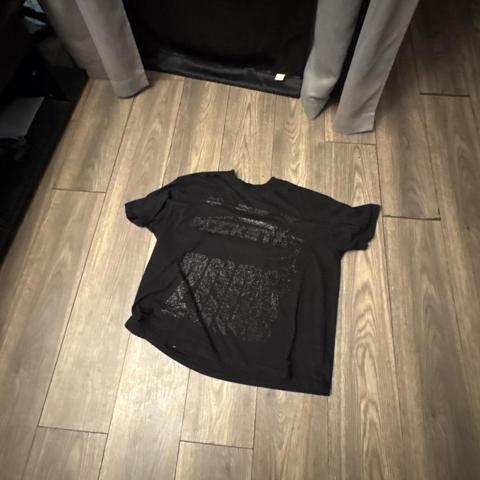 Black graphic tee with white text and abstract design #graphic