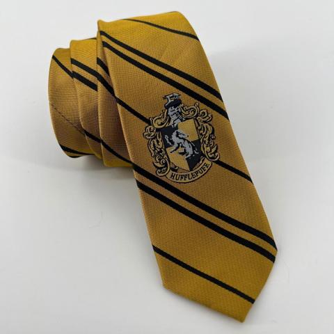 Harry Potter Hufflepuff Necktie Yellow Black Striped Cinereplicas Kids Cosplay

Official Harry Potter Hufflepuff house necktie by Cinereplicas features the iconic yellow and black striped design with a detailed embroidered house crest. Perfect for cosplay, school uniforms, or wizarding world fans, this high-quality replica captures the loyal and hardworking spirit of Hufflepuff house. The fabric has a subtle sheen and a classic diagonal ribbed texture, making it a versatile accessory for formal events or themed dress-up.

Measurements:
• Length: 44"
• Width: 2.5"

Brand: Cinereplicas
Character: Hufflepuff
Color: Yellow, Black
Pattern: Striped
Material: Polyester
Type: Necktie
Style: Cosplay, Academic
Theme: Harry Potter, Wizarding World
Occasion: Costume, Formal
Accents: Embroidered Crest
Width: Skinny/Slim
Gender: Kids Unisex

Keywords: Hogwarts, Badger, Wizard, Magic, Costume, Dress Up, School Tie, Bookish, Movie Replica, Geeky, Nerd, Halloween, Gift

***MEASU

#Vintage #Party #Retro