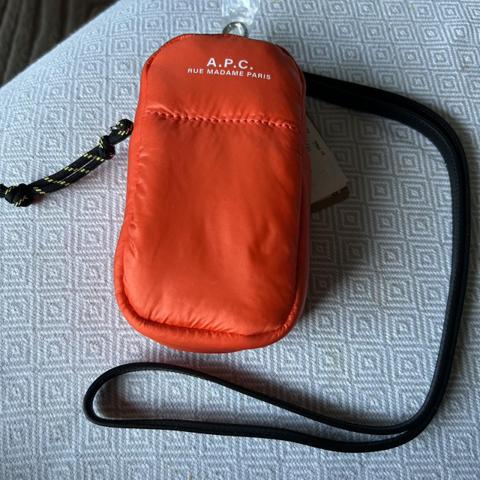 A.P.C. orange pouch with detachable leather strap. New with tags.