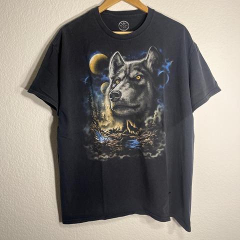 DOM Wolf Pack Men T-Shirt XL Black Midnight Graphic Nature Tee

DOM Midnight Wolf Pack graphic tee features a bold, detailed wolf print set against a celestial night sky with moons and a forest landscape. This short-sleeve crew neck shirt is crafted from a comfortable knit fabric blend, offering a regular fit that is perfect for casual wear or as a statement piece for nature enthusiasts. The dark black backdrop makes the blue and gold tones of the graphic pop, creating a striking visual impact.

Measurements:
• Width: 23"
• Length: 28"

#Streetwear #GraphicTee #Nature