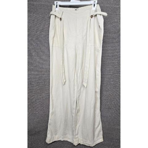 Beau Dawson Linen Blend Wide Leg Pants Beige High Waist Resortwear Beach Size M

Beau Dawson wide leg pants offer a relaxed yet sophisticated aesthetic, crafted from a breathable linen and rayon blend. These high-waisted trousers feature a comfortable elasticized back waistband and a stylish self-tie belt detail accented by buttons at the hips. Designed with a clean front and functional side pockets, they provide a breezy silhouette perfect for warm-weather styling or coastal-inspired looks.

Measurements:
• Waist: 15" (30" doubled)
• Rise: 12"
• Inseam: 31"
• Leg Opening: 11.5" (23" doubled)

#Neutral #Resortwear #Casual #Office