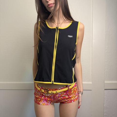y2k moschino mare zip up swim top vest

late 1990s to early 2000s rare Moschino mare zip front top in sleek swimsuit material with bright yellow contrast piping throughout
can be worn zipped up or partially open or fully unzipped 
perfect for the euro summer, moto, sporty y2k look

made in italy
no tagged size, can fit xs-m best

#moschino #y2k #archive #swimwear #designer