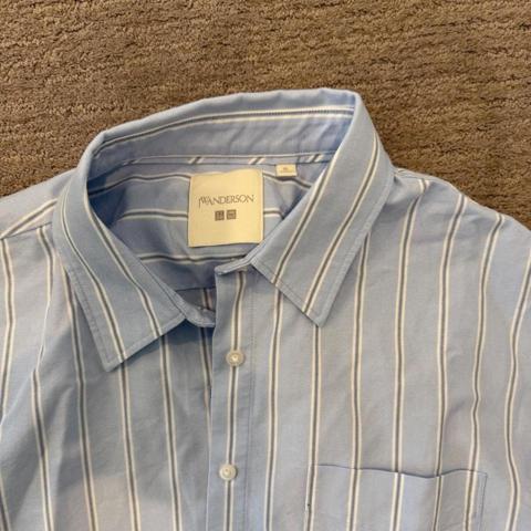 J.W. Anderson x Uniqlo Striped Button Down Shirt 

Light blue and white striped button-down from the J.W. Anderson x Uniqlo collaboration. Classic oversized look with a chest pocket and crisp collar. Easy everyday shirt that looks great worn alone or layered.

Size XL
Light blue & white stripe
Button front
Long sleeves
Chest pocket
J.W. Anderson x Uniqlo
Excellent pre-owned condition

#JWAnderson #Uniqlo #UniqloJWAnderson #StripedShirt #ButtonDown