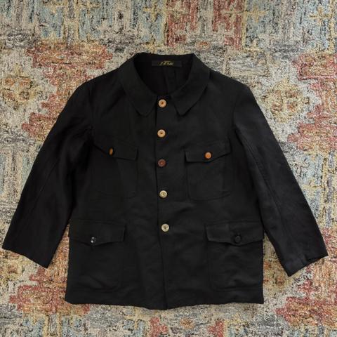Archivio J.M. Ribot wool linen work jacket w/ antique buttons in black, size 44 (fits men's relaxed US S). Valued at ~$1000-1200.
Wool/linen gabardine blend jacket with 4 front flap pockets, 2 back side hem pockets, and 1 interior large back pocket. Antique buttons throughout. Cat ear collar. Avant garde design for those who like Paul Harnden, Elena Dawson, Geoffrey B Small, Klasica, Ziggy Chen, Uma Wang, Araki Yuu, etc.
﻿In excellent preowned condition; general wear. One spot on right shoulder where outer fabric has separated a bit, but inner fabric still intact.
Width 55cm
Shoulder width 47cm
Sleeve length 55cm
Back length 68cm