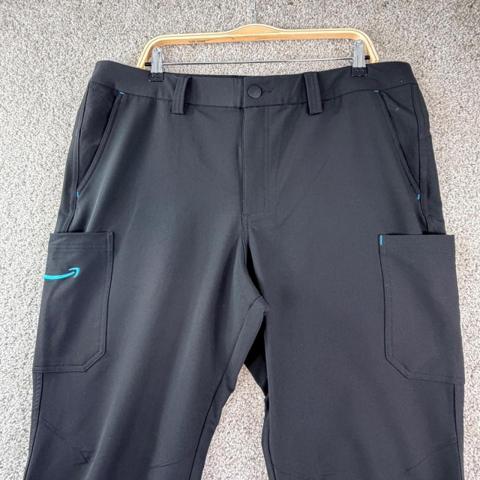 Men's Black Cargo Work Pants XL Performance Stretch Tactical Pocket Amazon Brand

Measurements:
• Waist: 37" (18.5" flat)
• Inseam: 31"
• Rise: 12"
• Leg Opening: 8.5"

Brand: Amazon Luly Yang
Type: Cargo Pants
Material: Performance Stretch
Pockets: 6-Pocket Design
Closure: Button and Zip Fly
Color: Black
Accent: Blue Interior Waistband
Fit: Straight Leg
Style: Workwear / Utility
Features: Belt Loops, Quick-Dry Fabric
Logo: Embroidered Smile on Cargo Pocket
Design: Designed in Seattle
Size: XL (37-40)

Keywords: Delivery Driver, Uniform, Techwear, Gorpcore, Tactical, Outdoor, Functional, Commuter, Athletic, Stretch, Minimalist, Logistics, Industrial

#Utility #Stretch #Techwear #Logistics #Functional