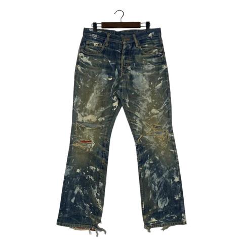 Yuji Yamada blue denim jeans with paint splatter design. Size: 29" #denim #japanese

Key Features:
• Designer: Yuji Yamada (Denim Furnishings line).
• Aesthetic: Grunge, industrial, and artisanal.
• Unique Details: Bright red fabric underlays at the knee blowouts and the back of the leg openings.
• Finish: Heavily distressed with paint splatter, whiskering, and frayed hems.
• Construction: High-quality Japanese denim with a classic 5-pocket design and custom leather waist patch.
Condition: Excellent vintage condition. All distressing, paint marks, and fraying are part of the original design and intended aesthetic of the garment.

Measurements (Laid Flat):
• Waist: 16" (Fits like 32) inches
• Inseam: 31" inches
• Leg Opening: 8.5" inches
• Front Rise: 12" inches
• Thigh: 12" inches
• Knee: 8" inches
Please compare these measurements with a pair of pants you already own to ensure a perfect fit!