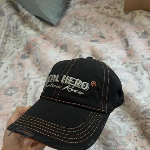 Martine Rose Local Hero Cap

Brand: Martine Rose
Color: Black / orange / silver
Size: Adjustable strapback

Description: Black Martine Rose “Local Hero” hat with silver embroidered front logo, orange contrast stitching, orange underbrim, and intentional distressed details throughout. Adjustable back strap with Martine Rose branding and “Expect Perfection” interior taping. Strong designer streetwear cap with a moto/workwear feel from the stitching.

Keywords: Martine Rose hat, Martine Rose cap, Local Hero hat, designer cap, black orange hat, contrast stitch cap, distressed hat, designer streetwear, luxury streetwear, archive streetwear, Y2K hat, grunge hat, punk hat, moto hat, workwear cap, embroidered cap, adjustable strapback

#y2k #designer #martinerose #streetwear #hat